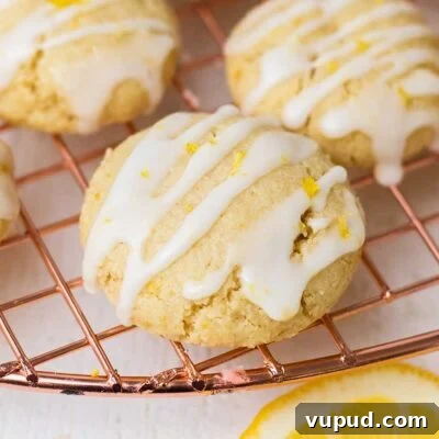 Chewy Gluten-Free Lemon Cookies (Dairy-Free Recipe) 8 A lemon cookie shown drizzled with a lemon glaze.