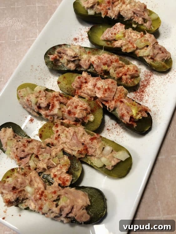 Tuna Salad Stuffed Avocado Boats for Quick Lunch 4 tuna salad boats on a white platter