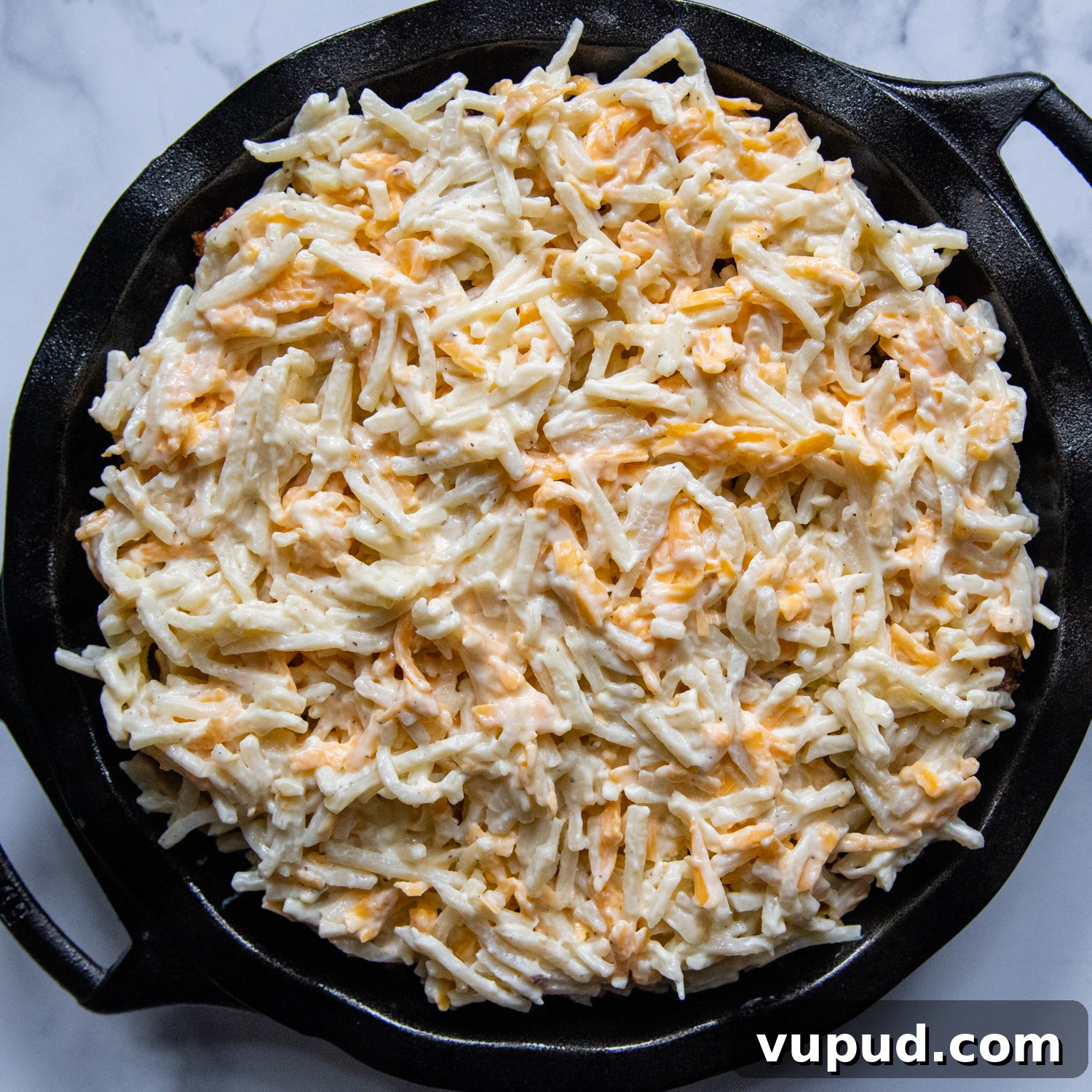 Quick Shepherd’s Pie Made with Crispy Hash Browns 6 cheesy hash brown topping over the casserole before baking.
