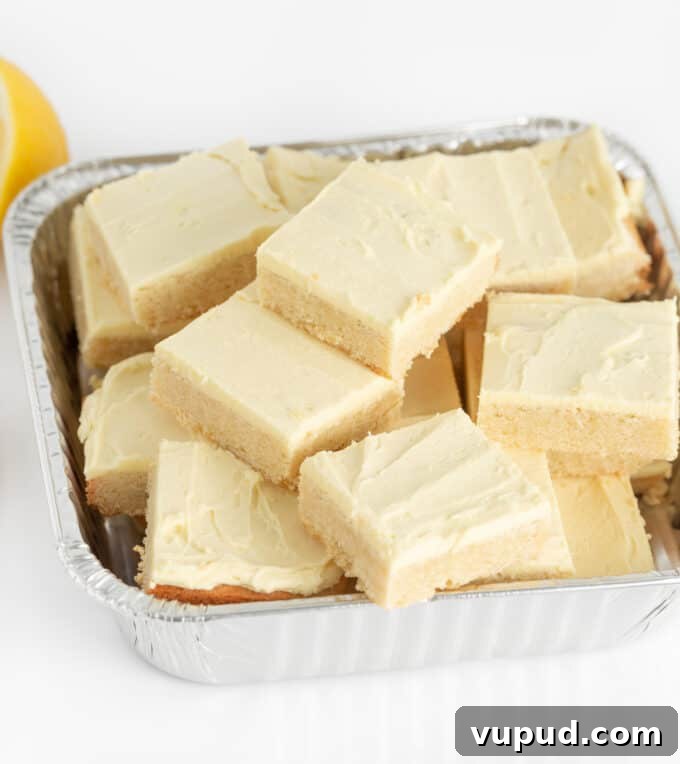 pan of cut lemon sugar cookie bar squares