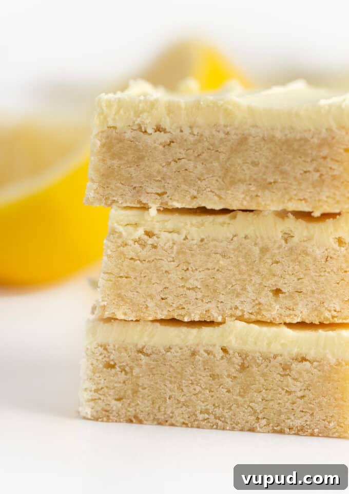 stack of lemon sugar cookie bars with lemon buttercream