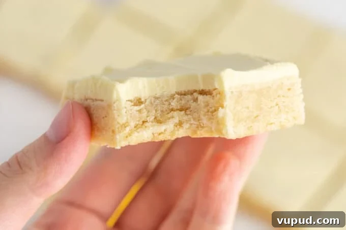 stack of lemon sugar cookie bars with lemon buttercream
