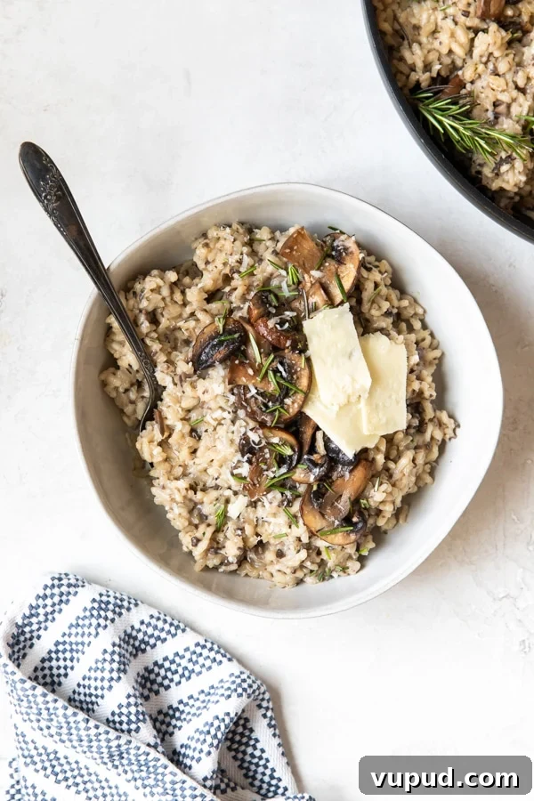 Creamy Mushroom Risotto with Rosemary and Parmesan 5 risotto in a white bowl