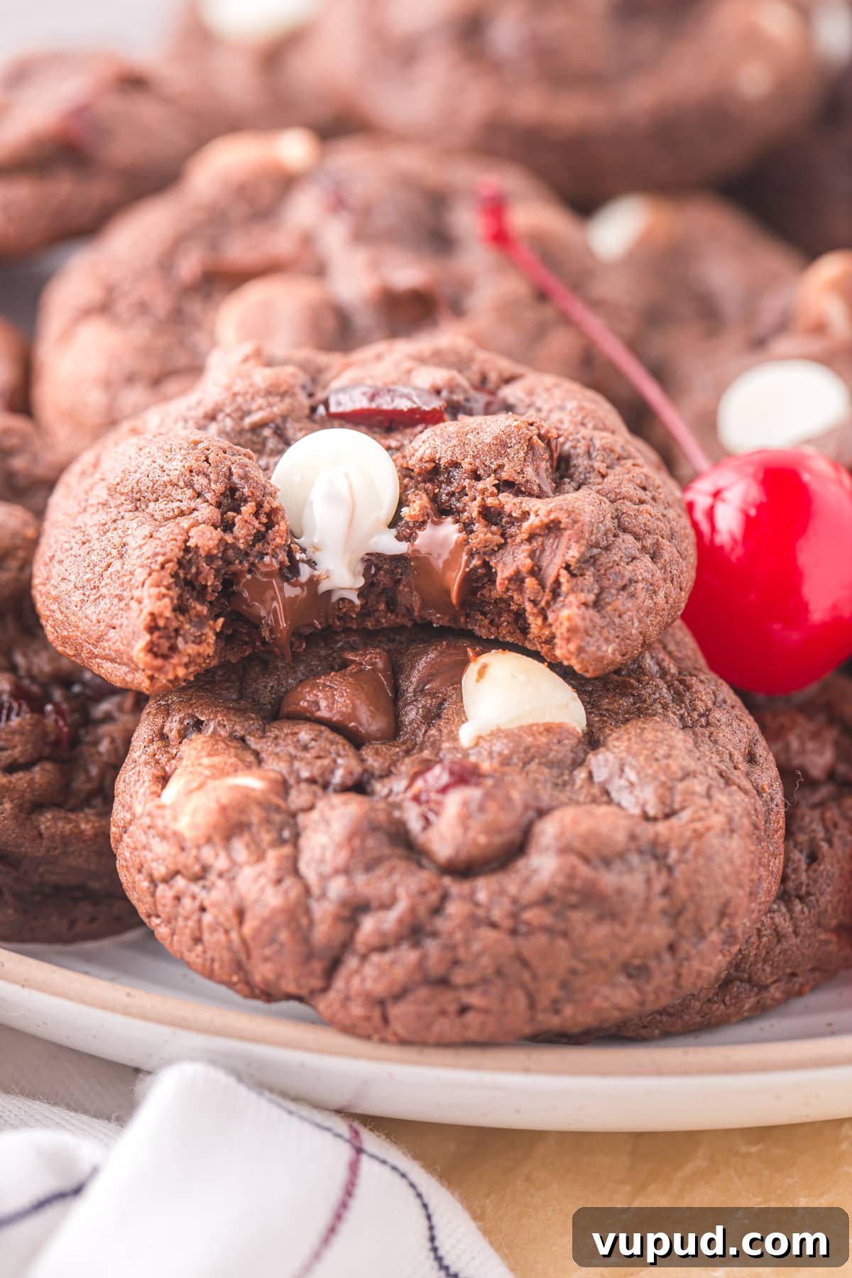 bite out of black forest cookie with cherries