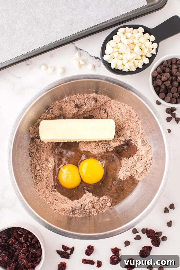 cookie dough mix with butter and eggs in bowl