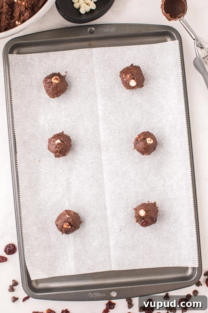 black forest cookies rolled in balls on baking sheet