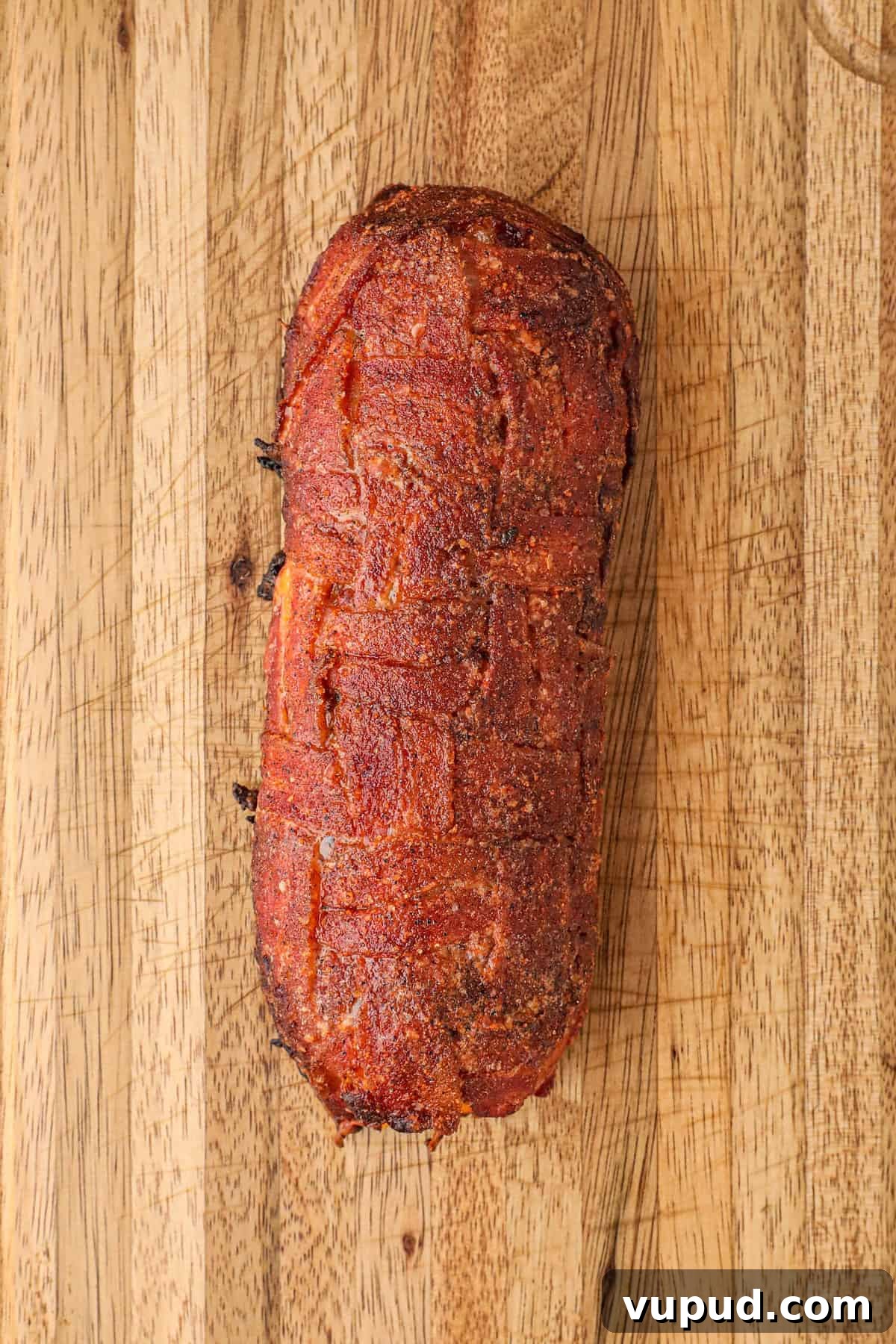 Smoked Breakfast Fatty: Savory Brisket-Wrapped Morning Roast 15 Allowing Fatty to Rest on Cutting Board for Smoked Breakfast Fatty Recipe