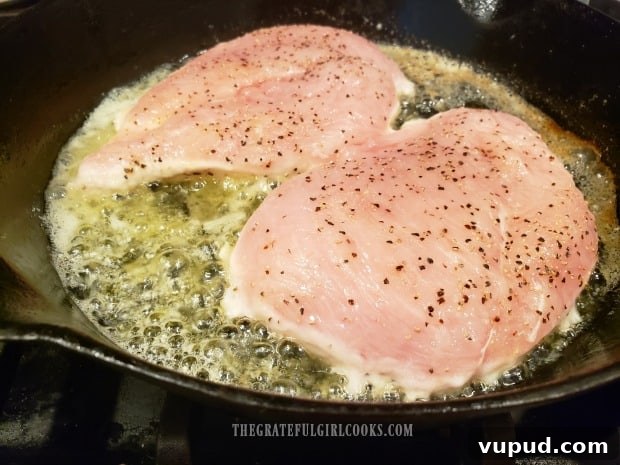 Pan-searing chicken Pan-searing chicken in melted butter in a cast iron skillet