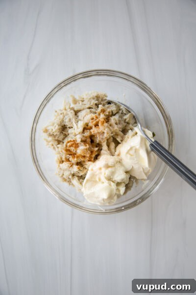 10-Minute Crab Dip with Crispy Tortilla Crust 11 lump crab meat in a bowl with mayo and creme fraiche