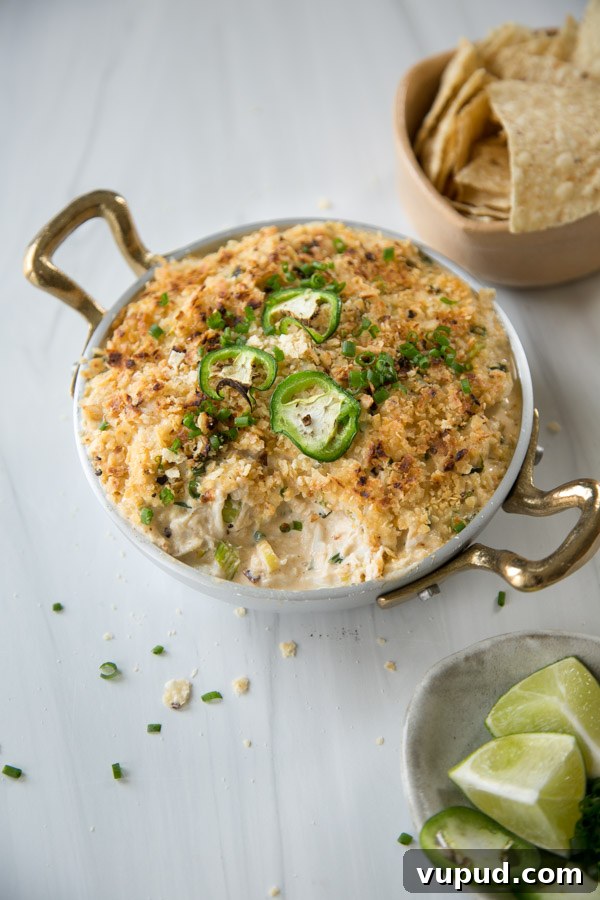 10-Minute Crab Dip with Crispy Tortilla Crust 20 creamy baked crab dip with tortilla chips on side