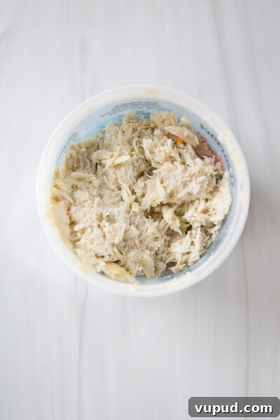 10-Minute Crab Dip with Crispy Tortilla Crust 7 lump crab meat in a container