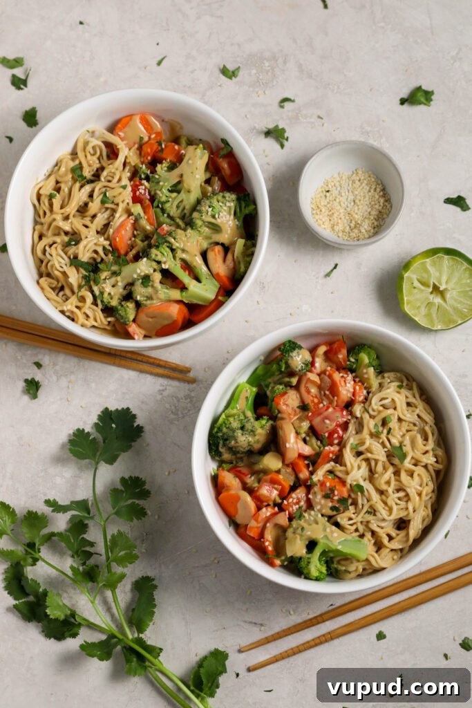 SunButter Peanut Butter Ramen Bowls: Creamy Savory Noodle Recipe 7 SunButter Ramen Noodle Bowls served in a bowls with cilantro and sesame seeds and chopsticks by Flora & Vino