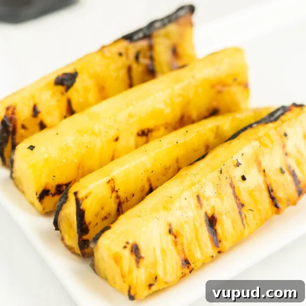 Crispy Pineapple Chicken on the Blackstone Grill: Sweet & Savory Recipe 12 Grilled Pineapple Spears on a platter