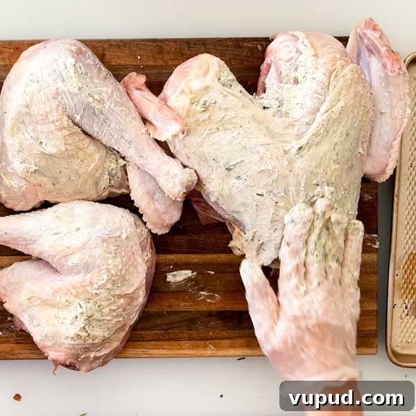 Spatchcock Turkey with Gluten-Free Gravy Cooked in HexClad Pan 10 Spreading garlic butter under and on top of the skin.