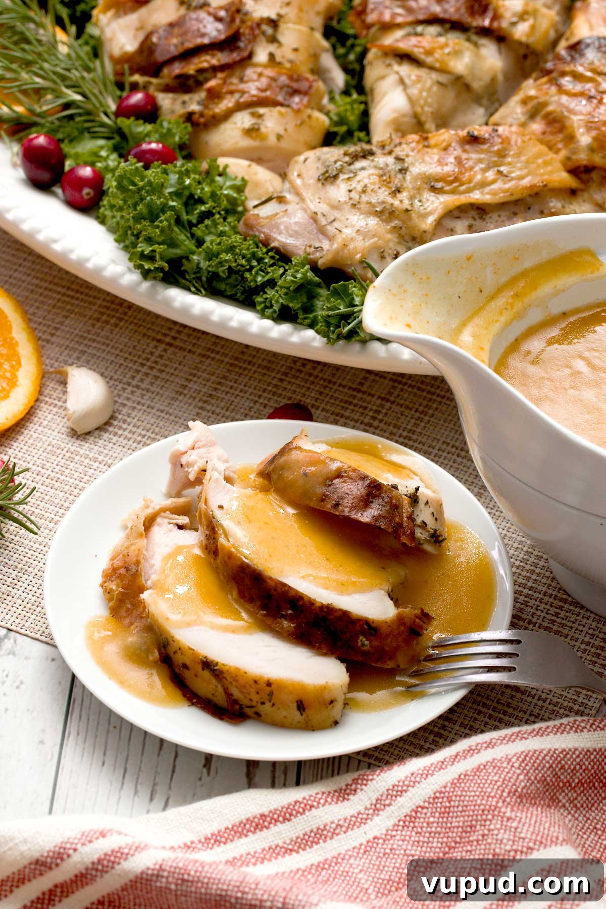 Spatchcock Turkey with Gluten-Free Gravy Cooked in HexClad Pan 18 Slices of spatchcocked turkey on a plate with gluten-free vegetable gravy.
