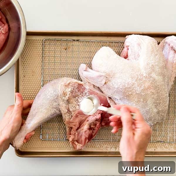 Spatchcock Turkey with Gluten-Free Gravy Cooked in HexClad Pan 7 Spreading the kosher salt and baking powder mix over the turkey skin.