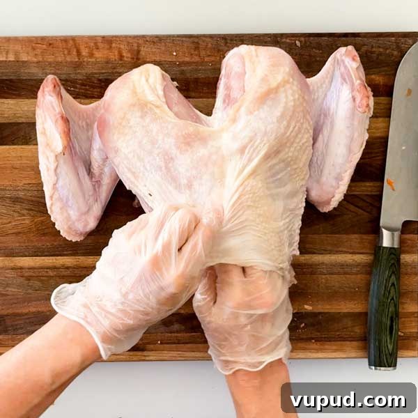 Spatchcock Turkey with Gluten-Free Gravy Cooked in HexClad Pan 9 Gently separating the skin from the meat by hand.