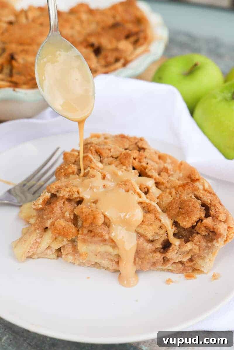 Caramel-Streusel Dutch Apple Pie Recipe 2 Caramel Dutch Apple Pie pouring caramel sauce