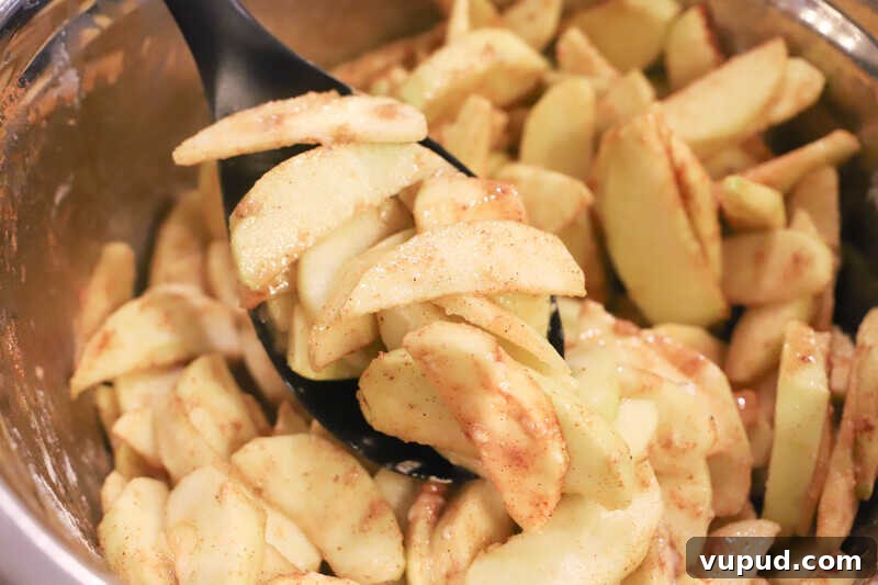 Caramel-Streusel Dutch Apple Pie Recipe 3 sliced apples in a bowl