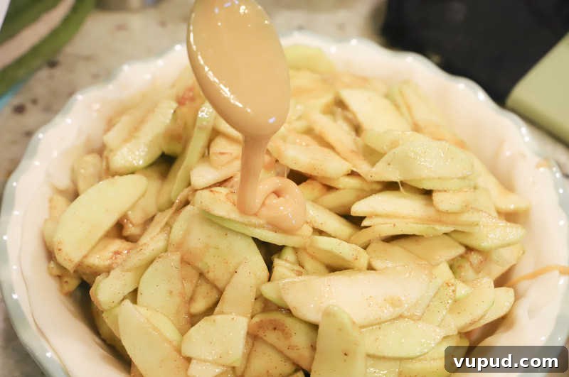 Caramel-Streusel Dutch Apple Pie Recipe 5 adding caramel to the pie
