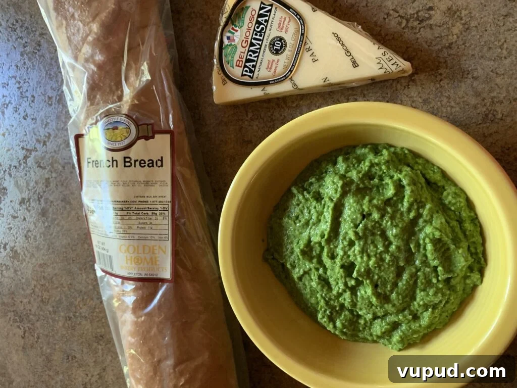 Creamy Pea Bruschetta with Lemon and Mint 4 A loaf of French bread, bowl of mushed pea mix, and a wedge of Parmesan cheese