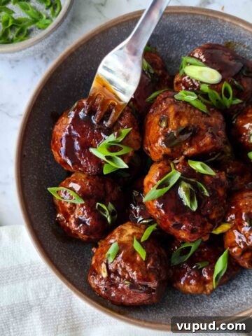 Bowl of saucy asian pork meatballs