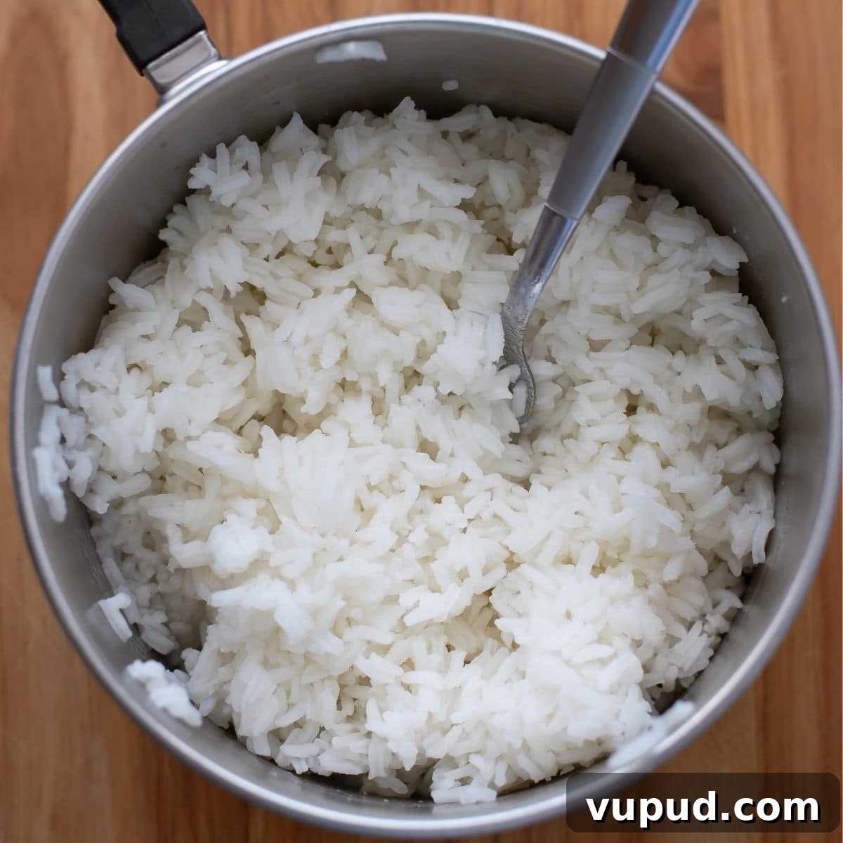 Slow-Cooker Stuffed Bell Peppers for Weeknight Dinner 4 A saucepan filled with perfect long grain white rice.