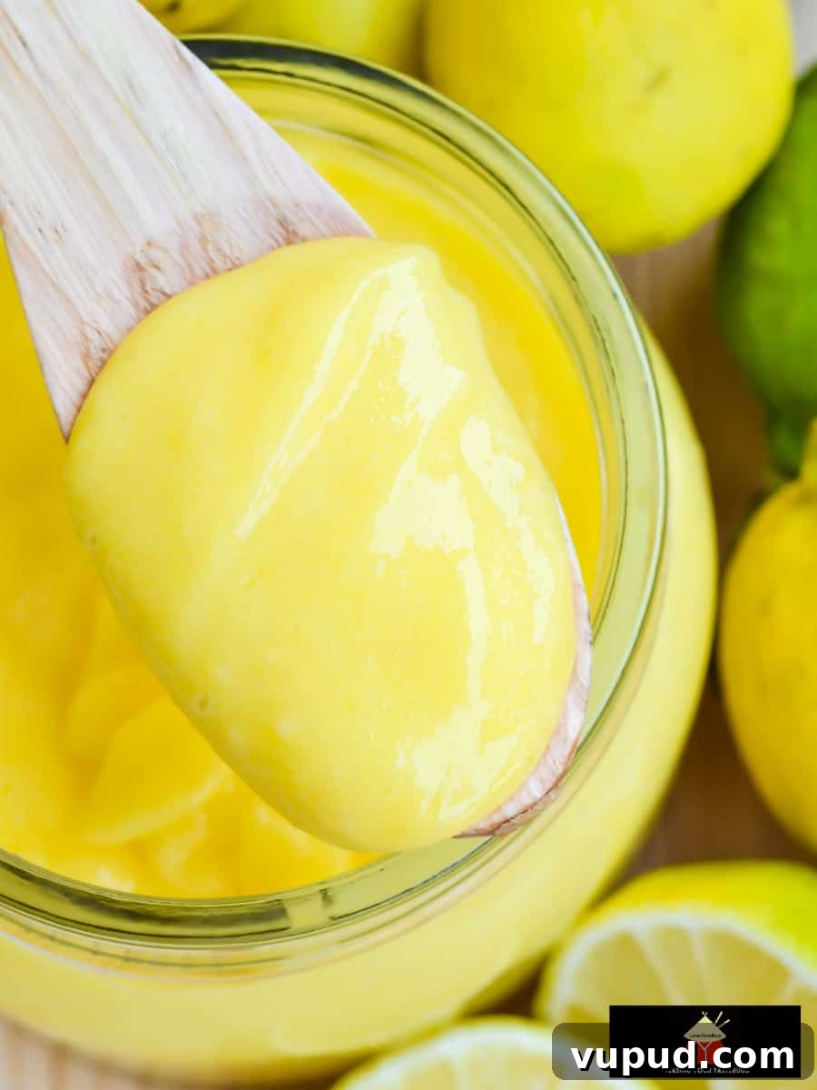 Creamy Homemade Lemon Curd Recipe for Smooth Citrus Spread 5 Strained lemon curd being poured