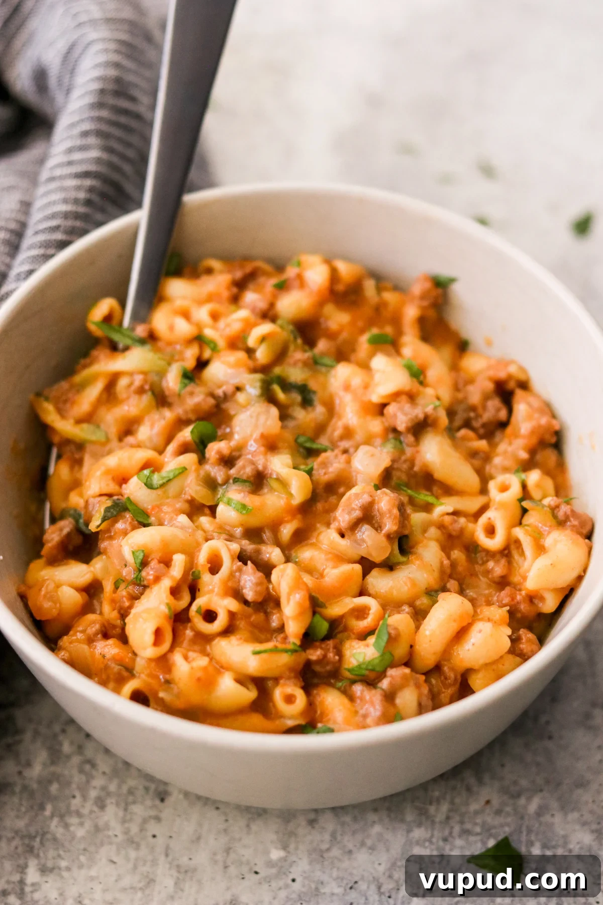 One-Pot Homemade Hamburger Helper: Quick Family Dinner 2 a bowl of hamburger helper with a spoon resting on the side