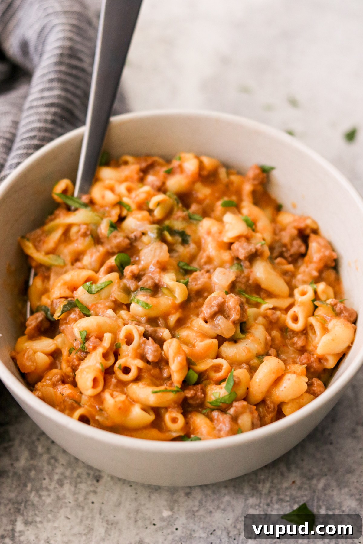 One-Pot Homemade Hamburger Helper: Quick Family Dinner 6 a bowl filled with ground beef, pasta, and a cheesy sauce.
