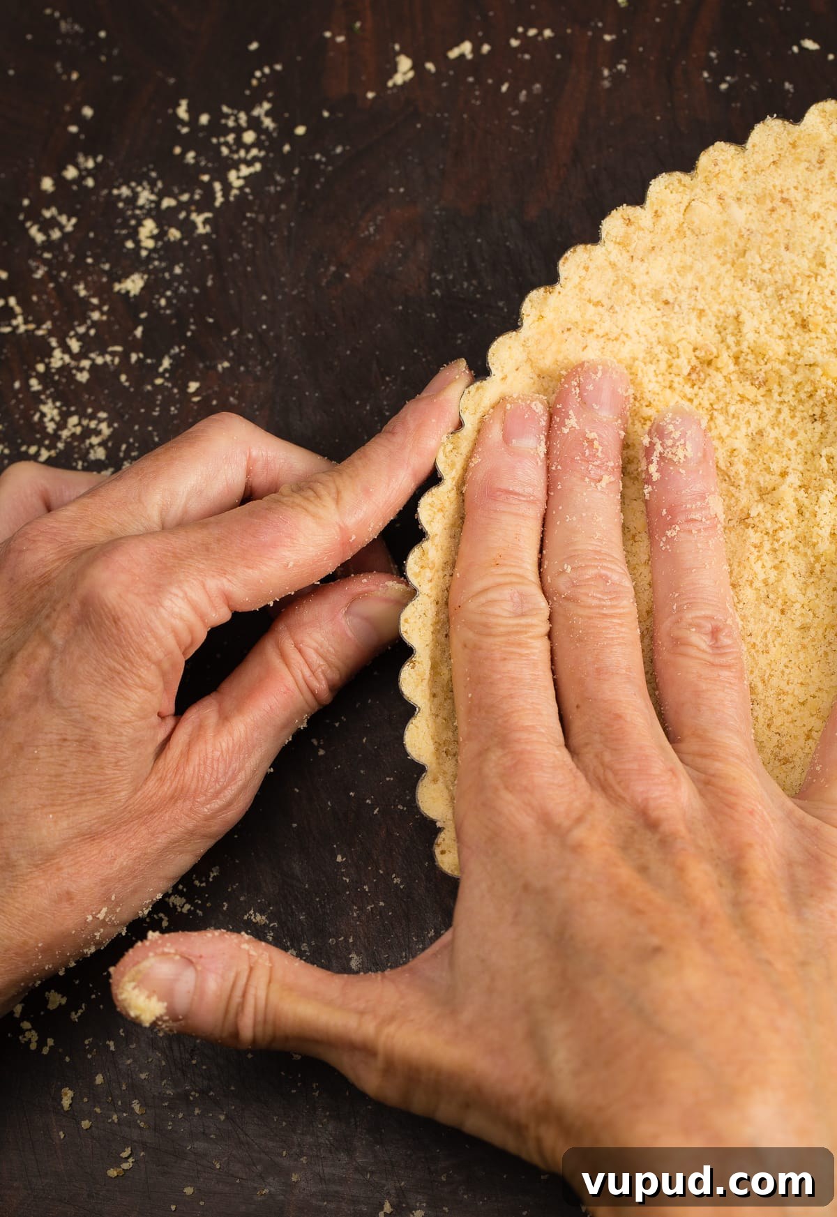 Grain-Free, Gluten-Free Tart Crust Recipe for Flaky Pastry 6 Forming a gluten free tart crust by hand in a tart pan.