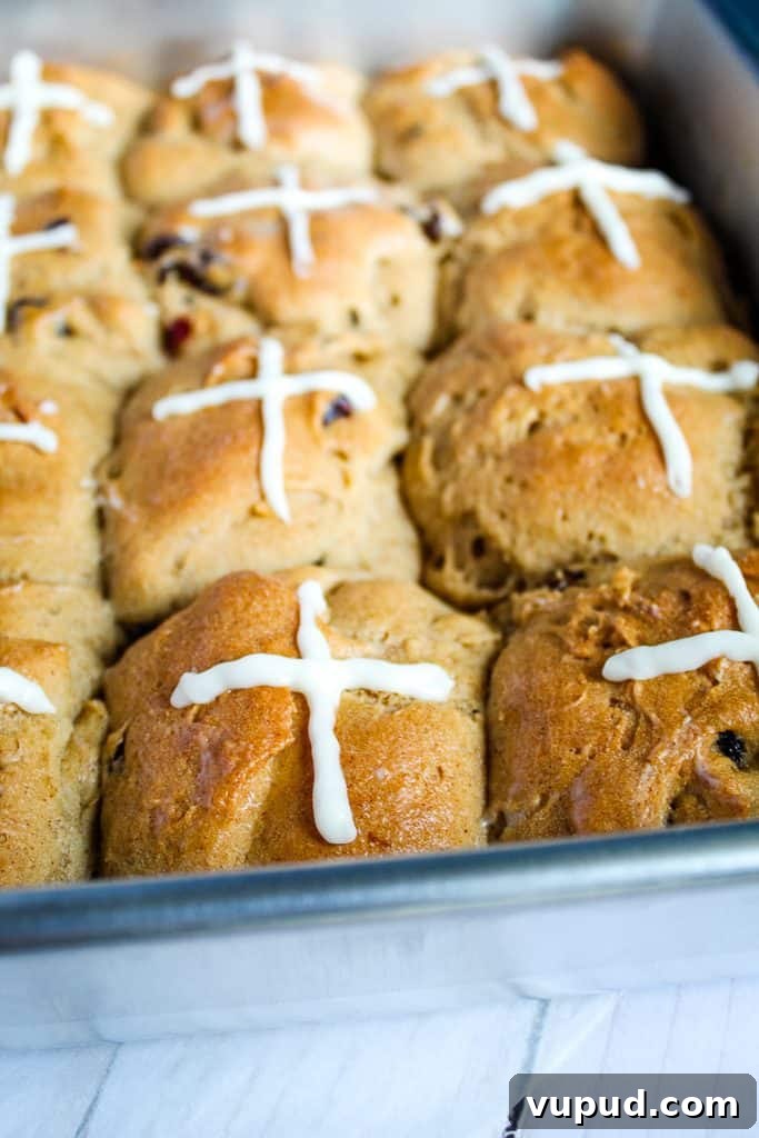 Soft & Fluffy Gluten-Free Hot Cross Buns: Simple Recipe for Spring 2 gluten free hot cross buns in a metal pan