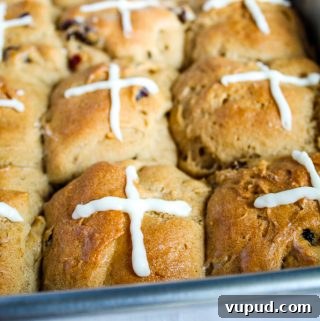 gluten free hot cross buns in a metal pan
