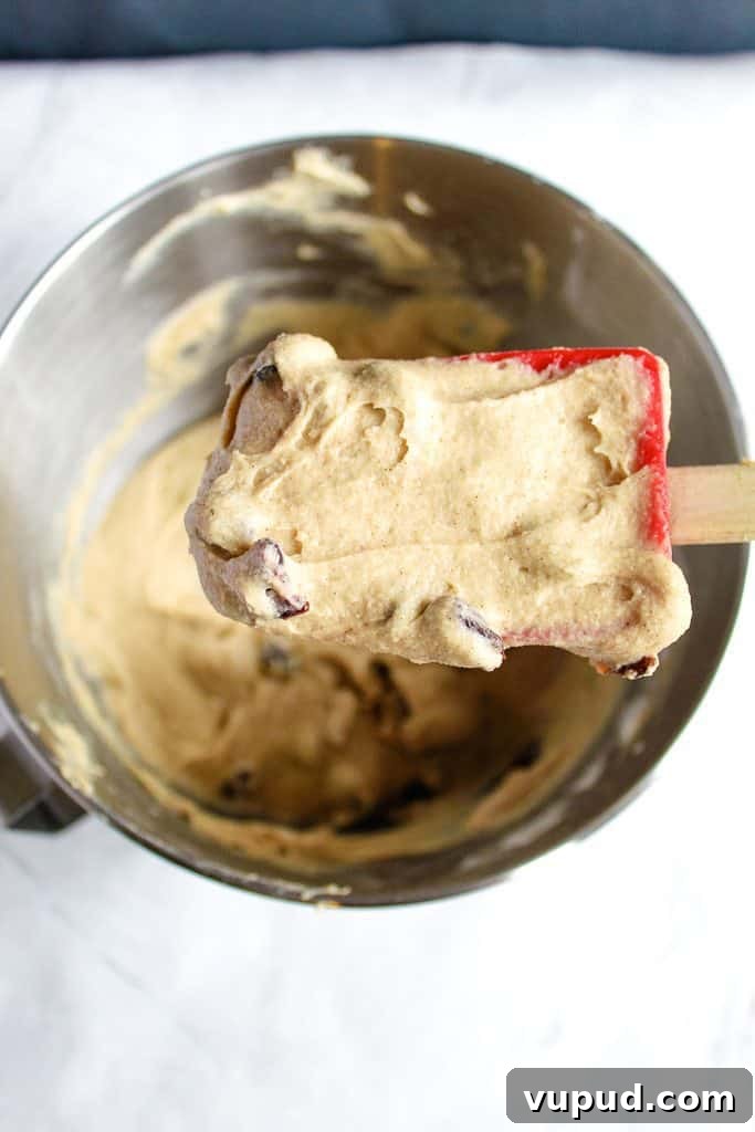 Soft & Fluffy Gluten-Free Hot Cross Buns: Simple Recipe for Spring 9 gluten-free hot cross bun batter on a spoon, close up