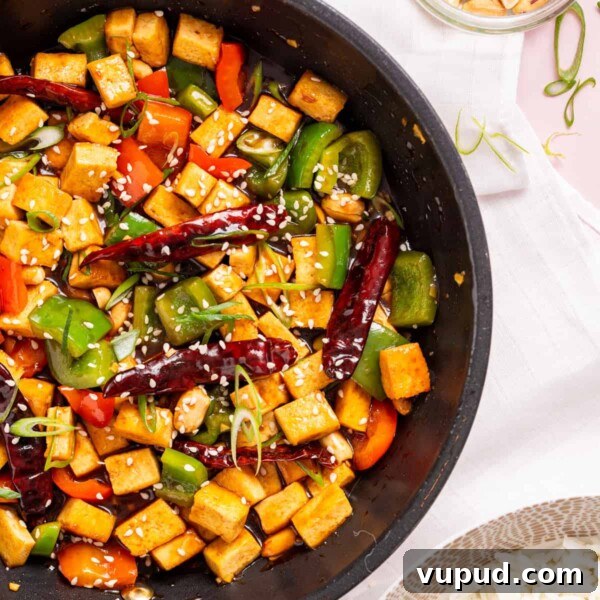 Crispy Tofu Katsu Recipe: Crunchy Plant-Based Cutlets 12 An overhead image of kung pao tofu in a skillet.