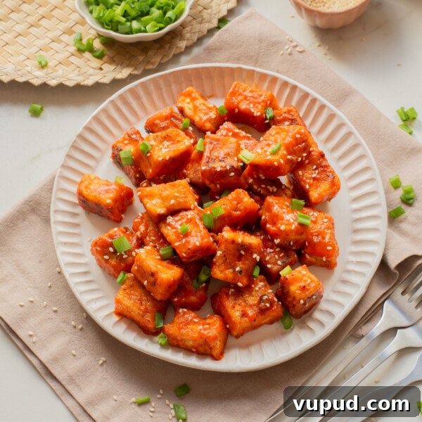 Crispy Tofu Katsu Recipe: Crunchy Plant-Based Cutlets 14 An overhead image of buffalo tofu on a plate.
