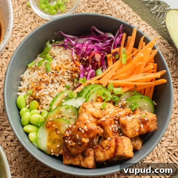 Crispy Tofu Katsu Recipe: Crunchy Plant-Based Cutlets 15 An overhead image of tofu bowl served over rice.