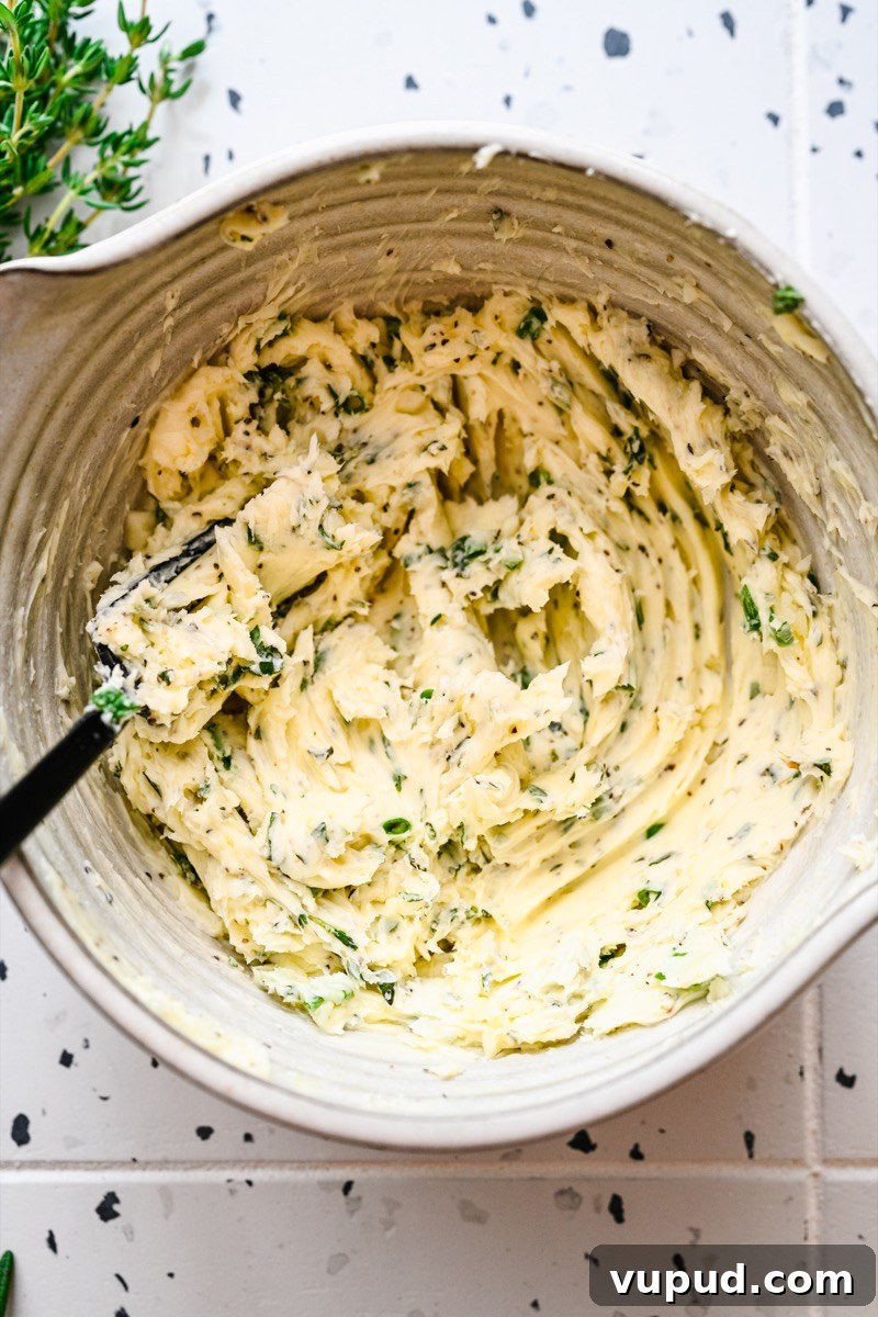 Garlic Herb Compound Butter Recipe for Flavorful Meals 3 Compound butter log on parchment