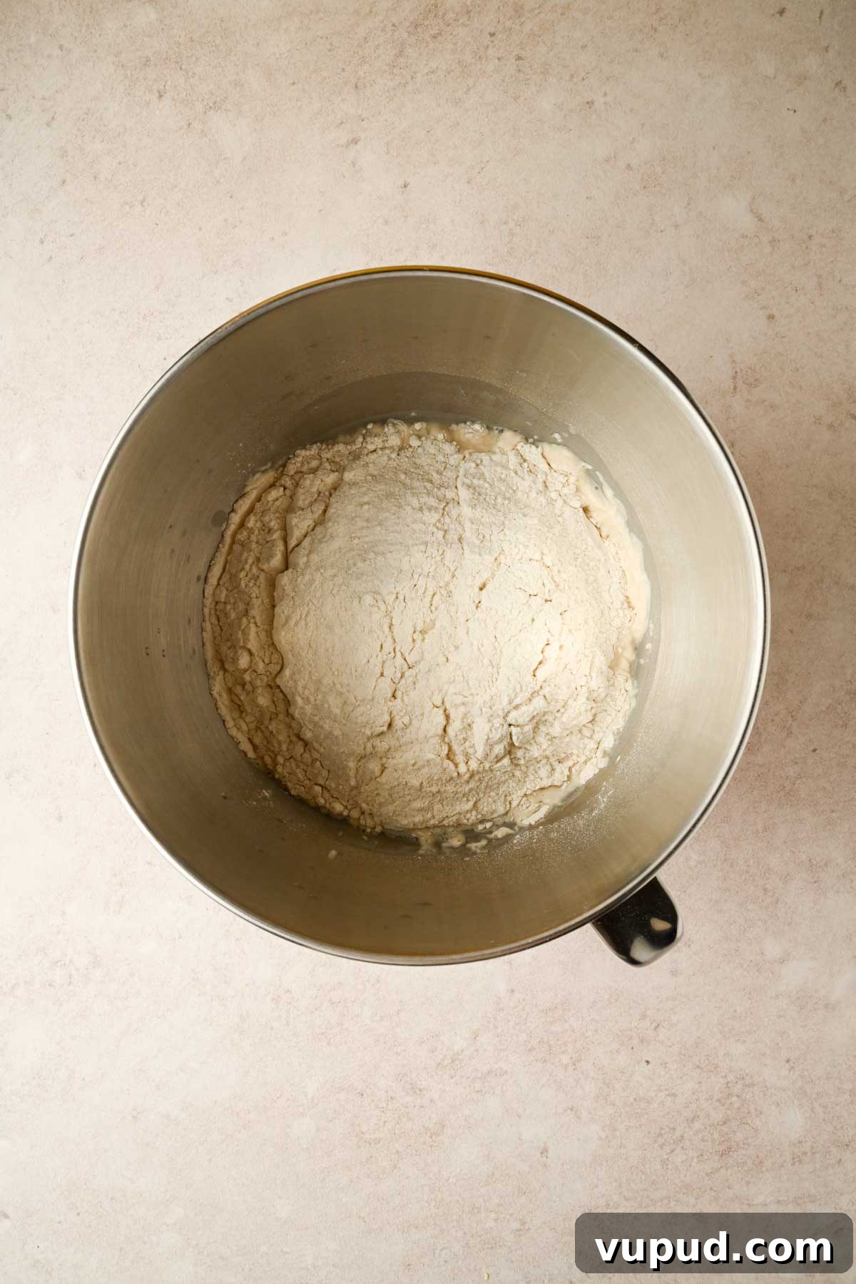 Raspberry Jam Sweet Focaccia Recipe for Soft, Fruity Bread 4 flour in silver stand mixer bowl.