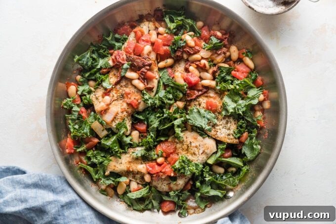 Tuscan Chicken with White Beans and Kale Recipe 6 Skillet with chicken breasts, white beans, kale, and sun-dried tomatoes all in a light sauce.