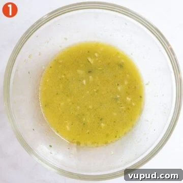 Crispy Chicken Spiedini Skewers with Lemon Herb Marinade 4 Lemon garlic marinade in a bowl.