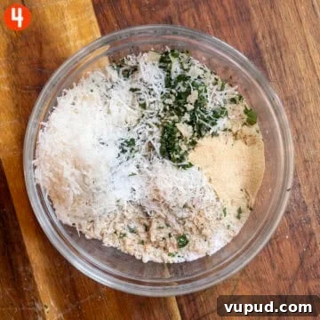 Crispy Chicken Spiedini Skewers with Lemon Herb Marinade 7 Breadcrumbs, Parmesan, Parsley, and seasonings in a bowl.