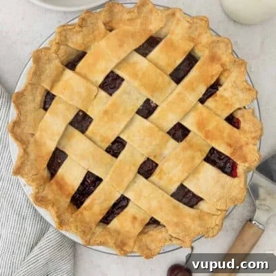 overhead view of cherry pie with lattice work.