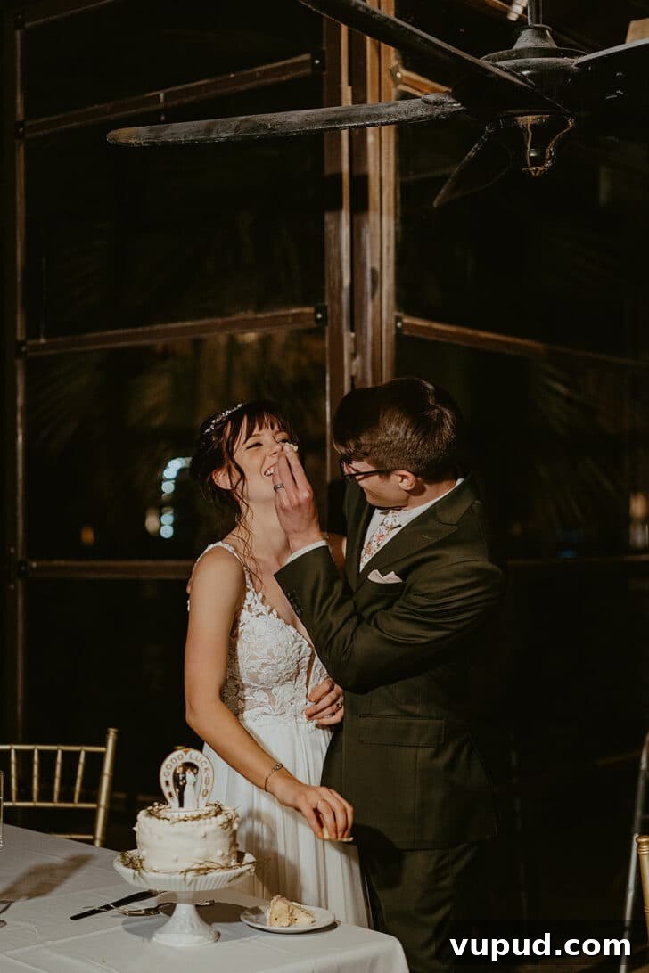 Cardamom Cake with Silky Coffee Buttercream 9 A groom smashing cake into a bride's face in a dark restaurant.
