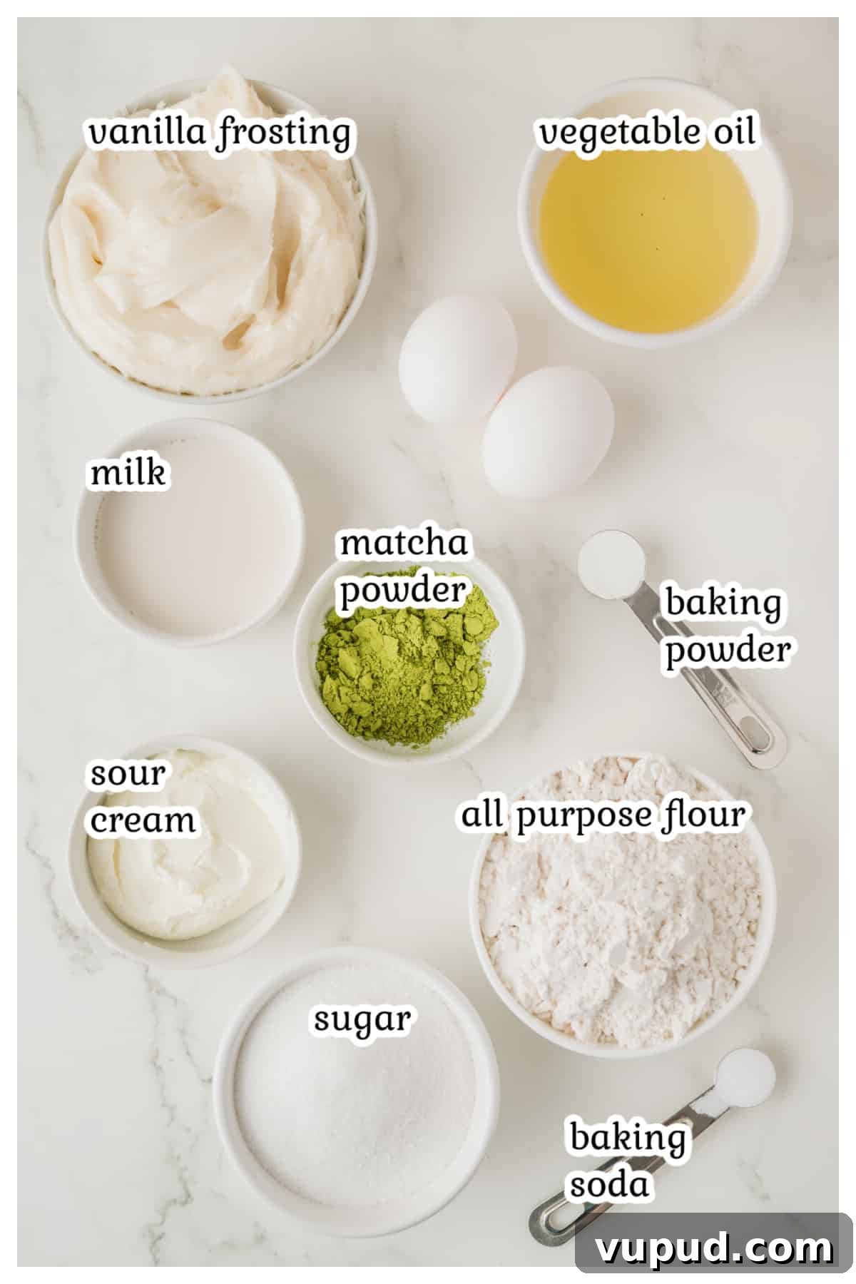Matcha Cupcakes Recipe: Moist Green Tea Cupcakes with Frosting 3 Ingredients for the matcha cupcakes on a white surface.