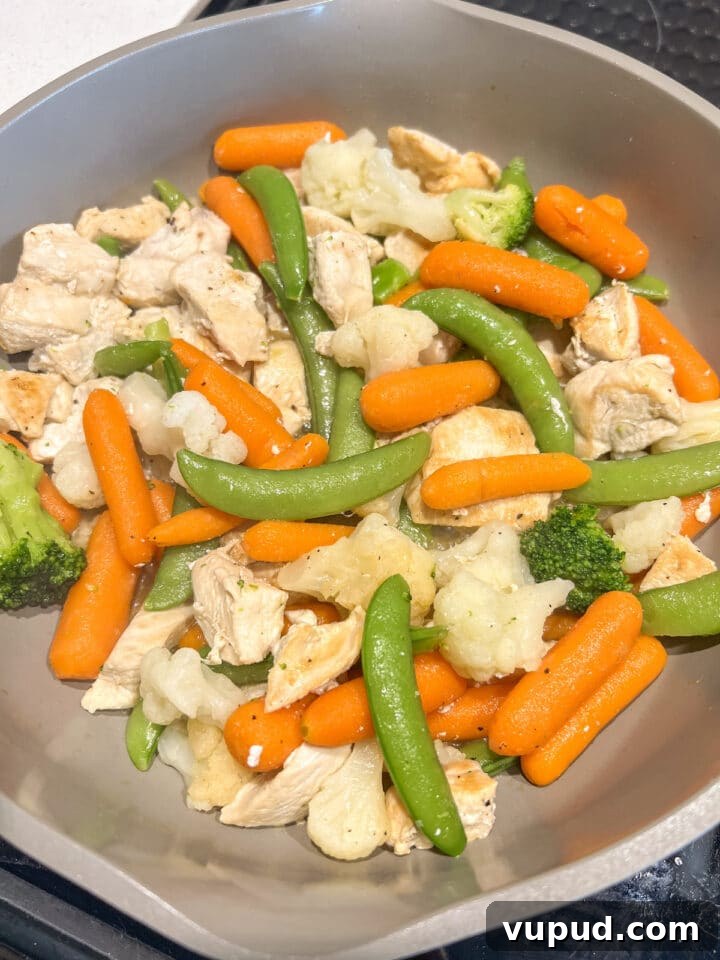 Sesame Garlic Stir-Fry with Frozen Vegetables 6 Cooked chicken and frozen vegetables in a large non-stick pan