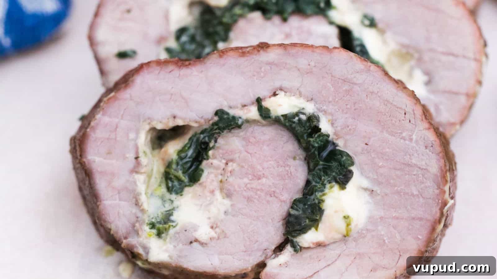 30 Flavorful Low-Carb Main Dishes That Feel Like Real Meals 9 Stuffed steak pinwheels sliced on platter.