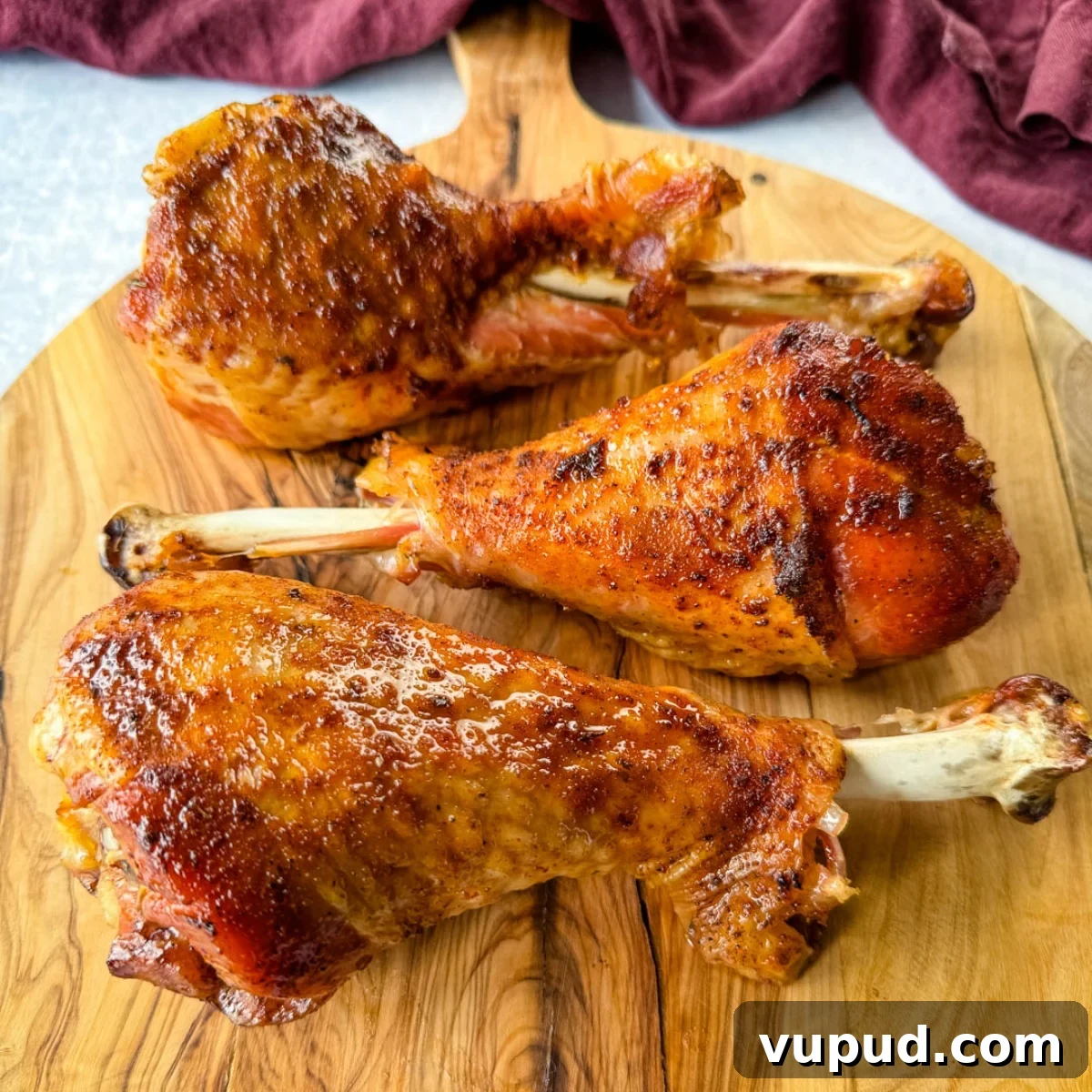 Smoky Traeger Turkey Legs Recipe: Juicy Wood-Fired Flavor 2 smoked turkey legs on a plate
