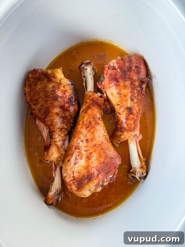Smoky Traeger Turkey Legs Recipe: Juicy Wood-Fired Flavor 11 smoked turkey legs in a slow cooker