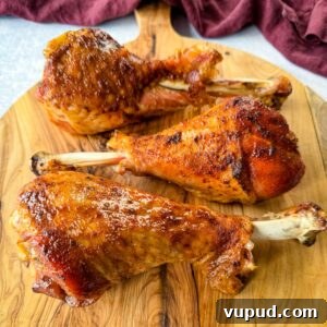 Smoky Traeger Turkey Legs Recipe: Juicy Wood-Fired Flavor 13 smoked turkey legs on a plate